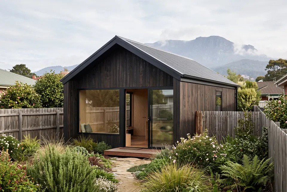 New Town granny flat in charred timber with kunanyi / Mount Wellington behind